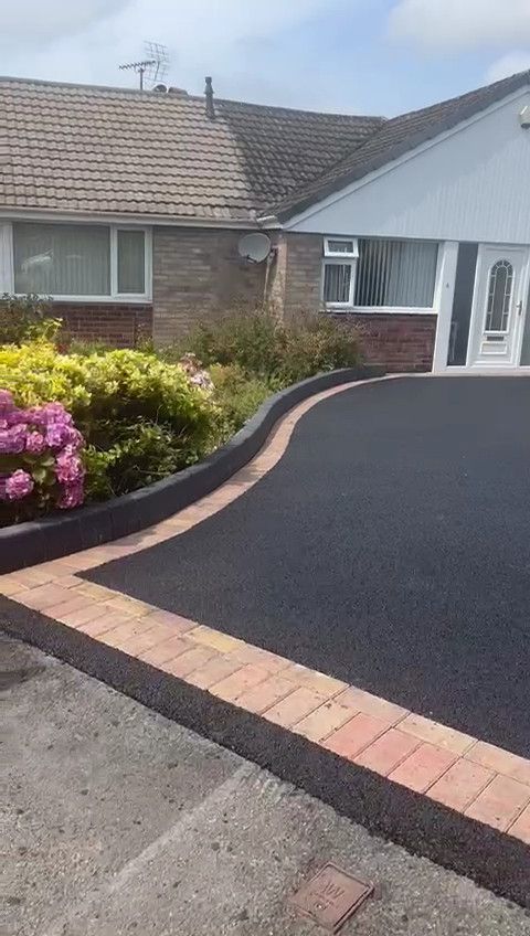 Tarmac with red block edge border.