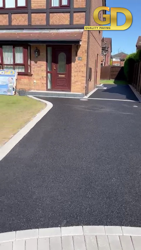 Drive and paths in tarmac to a house in tarvin near Chester.