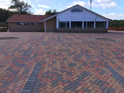 Block paved car park.